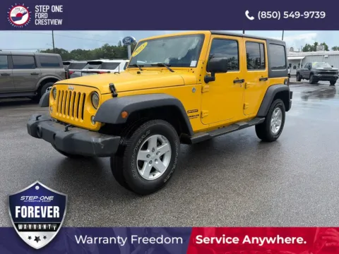 Yellow 2015 Jeep Wrangler Unlimited Sport for sale in Crestview, FL