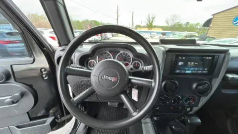 Photos of 2010 Jeep Wrangler Unlimited Sport SUV 4D for sale in Broken Arrow, OK at JT Wholesale Auto, Inc.