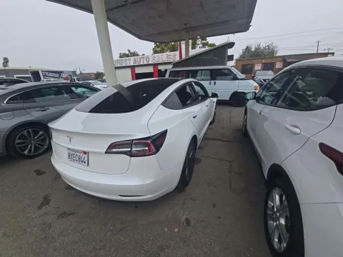 Photos of 2021 Tesla Model 3 Standard Range Plus NAV,CAM,PANO,HTD STS,BLIND SPO for sale in Irving, TX at Autos of Dallas - Irving