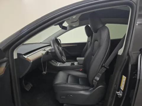 More photos of 2025 Tesla Model Y Long Range NAV,CAM,PANO,HTD STS,BLIND SPOT,19" WLS at Autos of Dallas - Irving, TX