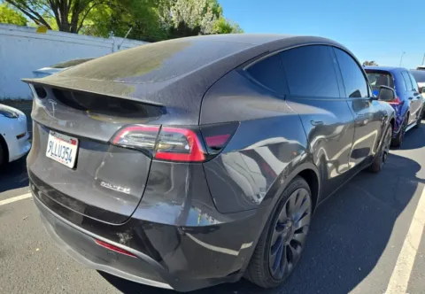 Photos of 2024 Tesla Model Y Performance NAV,CAM,PANO,HTD STS,BLIND SPOT for sale in Irving, TX at Autos of Dallas - Irving