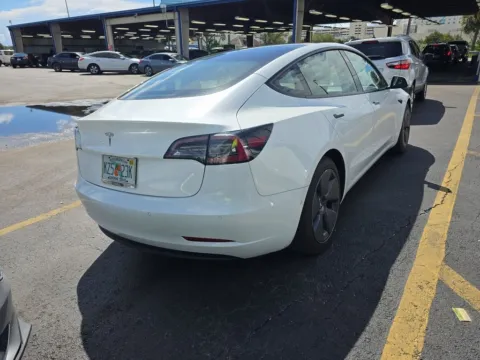 Photos of 2021 Tesla Model 3 Standard Range Plus NAV,CAM,PANO,HTD STS,BLIND SPO for sale in Irving, TX at Autos of Dallas - Irving