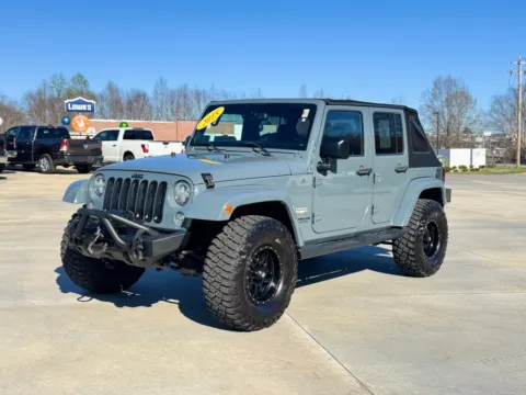Gray 2015 JEEP WRANGLER UNLIMI SAHARA for sale in Forest City, NC