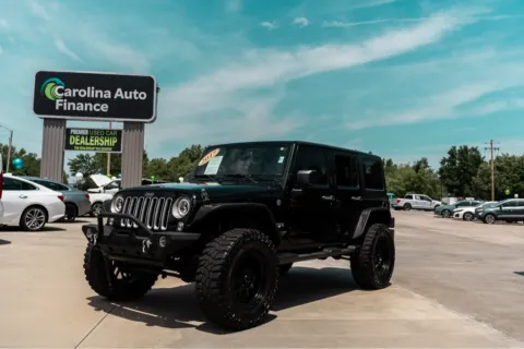 Black 2017 JEEP WRANGLER UNLIMI SAHARA for sale in Forest City, NC
