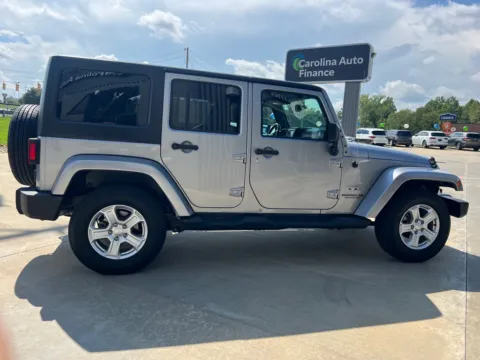 Another view of 2016 JEEP WRANGLER UNLIMI SAHARA for sale in Forest City, NC at Carolina Auto Finance
