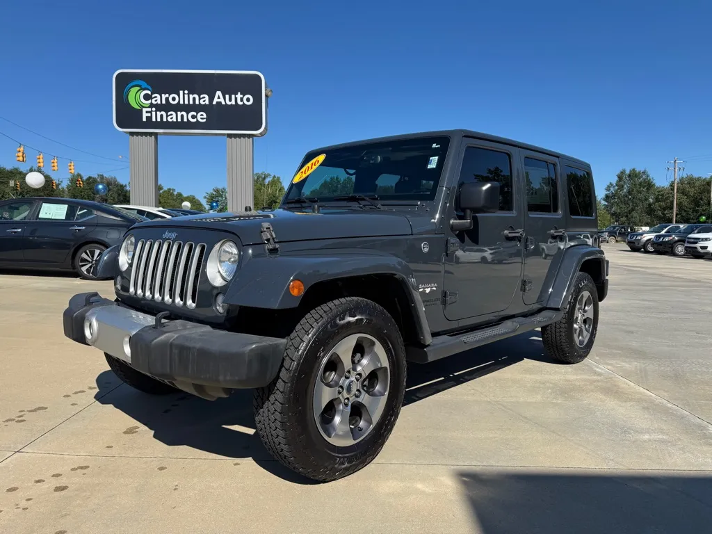 Gray 2016 JEEP WRANGLER UNLIMI SAHARA for sale in Forest City, NC