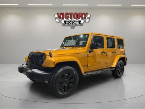 Yellow 2014 Jeep Wrangler Unlimited Sahara 4x4 4dr SUV for sale in Lake Orion, MI
