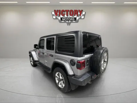 Another view of 2018 Jeep Wrangler Unlimited Sahara 4x4 4dr SUV (midyear release) for sale in Lake Orion, MI at Victory Motors Lake Orion