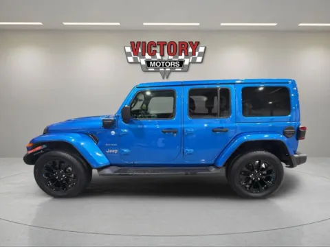 Photos of 2022 Jeep Wrangler Unlimited Sahara 4xe 4x4 4dr SUV for sale in Lake Orion, MI at Victory Motors Lake Orion