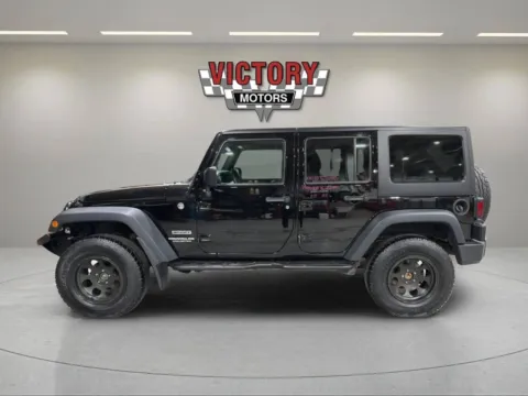 Photos of 2015 Jeep Wrangler Unlimited Sport 4x4 4dr SUV for sale in Lake Orion, MI at Victory Motors Lake Orion