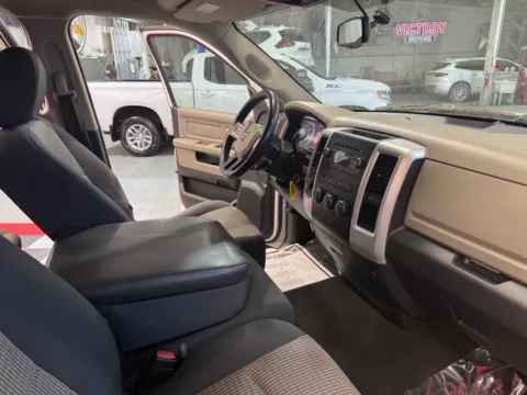 Another view of 2010 Dodge Ram 1500 SLT 4x4 4dr Quad Cab 6.3 ft. SB Pickup for sale in Lake Orion, MI at Victory Motors Lake Orion