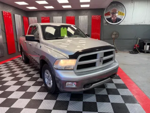 Silver 2011 RAM 1500 SLT 4x4 4dr Quad Cab 6.3 ft. SB Pickup for sale in Lake Orion, MI