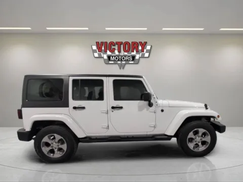 Photos of 2018 Jeep Wrangler JK Unlimited Sahara 4x4 4dr SUV for sale in Lake Orion, MI at Victory Motors Lake Orion