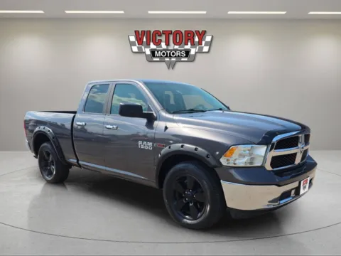 Gray 2016 RAM 1500 SLT 4x4 4dr Quad Cab 6.3 ft. SB Pickup for sale in Chesterfield, MI