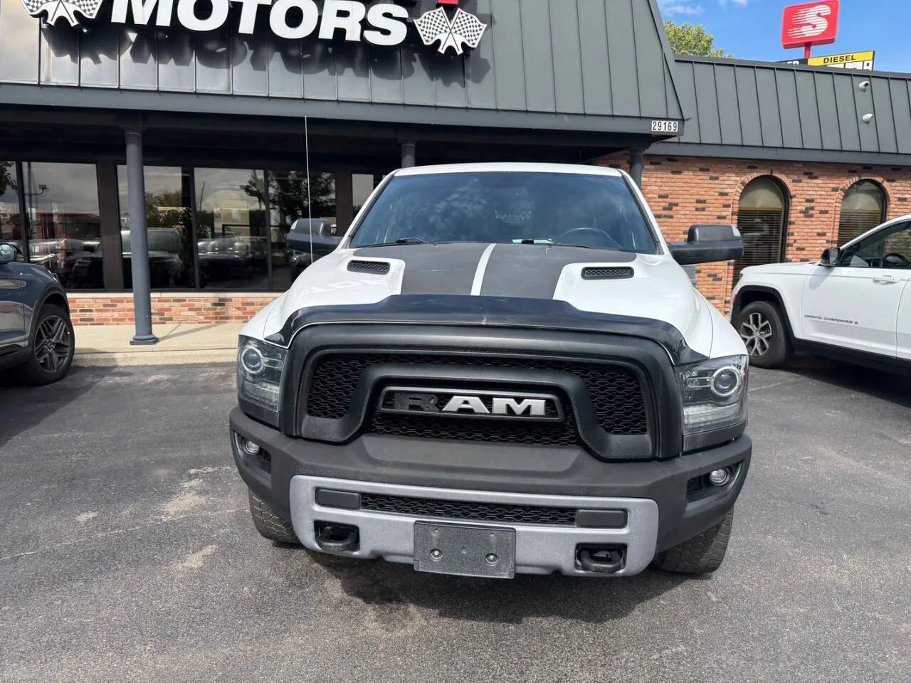 White 2016 RAM 1500 Rebel 4x4 4dr Crew Cab 5.5 ft. SB Pickup for sale in Chesterfield, MI