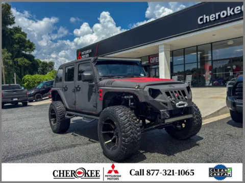 Black 2014 Jeep Wrangler Unlimited Sport for sale in Canton, GA