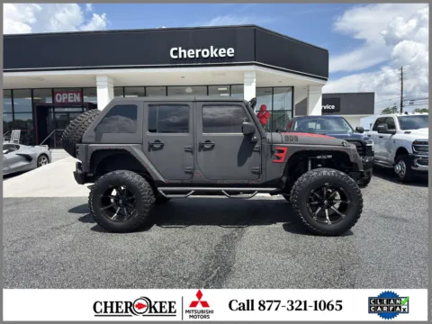Photos of 2014 Jeep Wrangler Unlimited Sport for sale in Canton, GA at Cherokee Mitsubishi