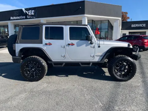 Photos of 2010 Jeep Wrangler Unlimited Sahara for sale in Canton, GA at Cherokee Mitsubishi