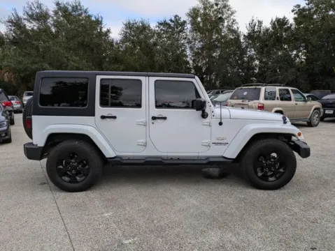 Another view of 2015 Jeep Wrangler Unlimited Sahara for sale in Jacksonville, FL at Auto Gallery Jacksonville