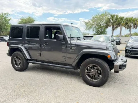 Gray 2016 Jeep Wrangler Unlimited Sahara for sale in Jacksonville, FL