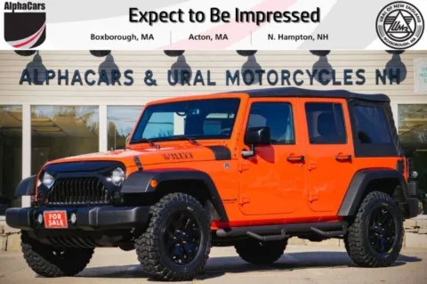 Orange 2015 Jeep Wrangler Unlimited Sport 4WD for sale in North Hampton, NH