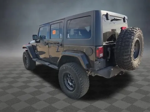 Another view of 2013 Jeep Wrangler Unlimited Sahara for sale in Colorado Springs, CO at McCloskey Truck Town (Licensed as McCloskey Motors Inc.)