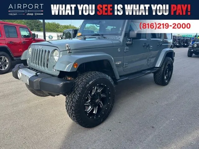 Used 2014 Jeep Wrangler Unlimited Sahara with VIN 1C4BJWEG5EL128853 for sale in Kansas City