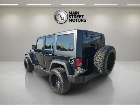 Another view of 2014 Jeep Wrangler Unlimited Sport SUV 4D for sale in Portage, IN at Main Street Motors