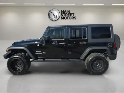 Photos of 2014 Jeep Wrangler Unlimited Sport SUV 4D for sale in Portage, IN at Main Street Motors