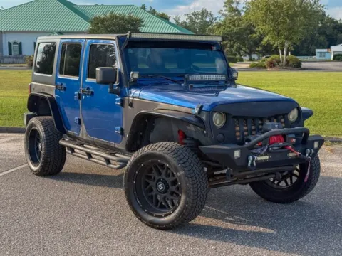 Blue 2010 Jeep Wrangler Unlimited Sport for sale in Foley, AL