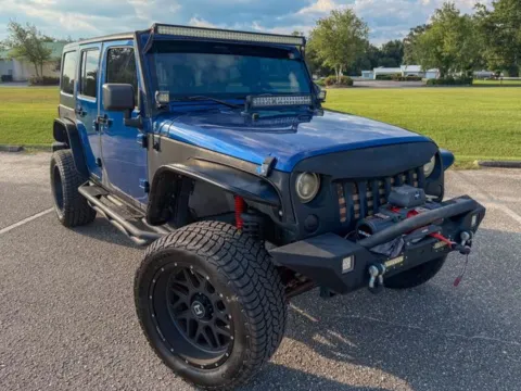 Photos of 2010 Jeep Wrangler Unlimited Sport for sale in Foley, AL at Coastal Auto Group
