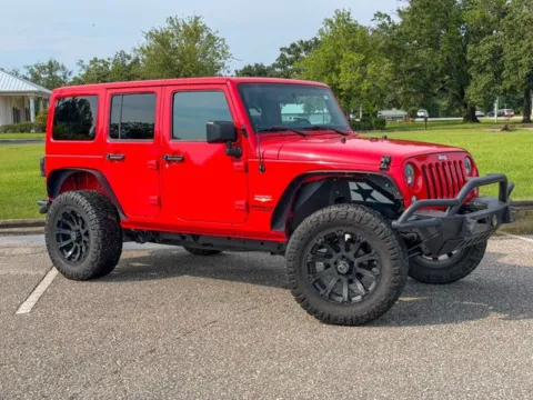 Red 2015 Jeep Wrangler Unlimited Sahara for sale in Foley, AL