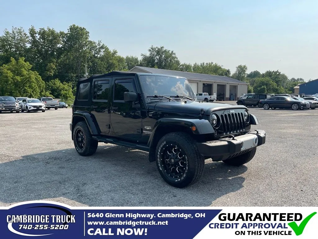 Black 2015 Jeep Wrangler Unlimited Sahara for sale in Cambridge, OH