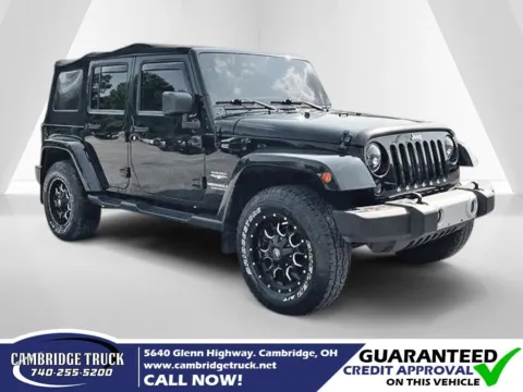 Black 2015 Jeep Wrangler Unlimited Sahara for sale in Cambridge, OH