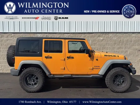 Orange 2012 Jeep Wrangler Unlimited Sport for sale in Wilmington, OH