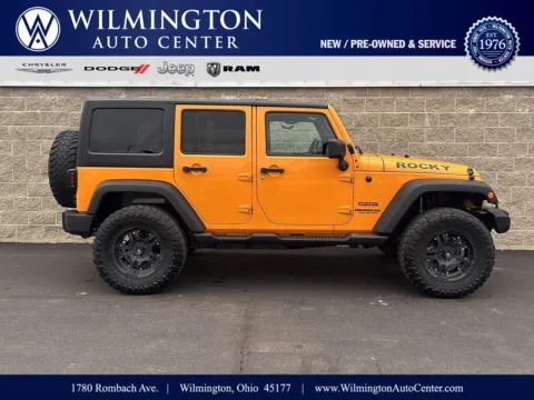 Orange 2012 Jeep Wrangler Unlimited Sport for sale in Wilmington, OH