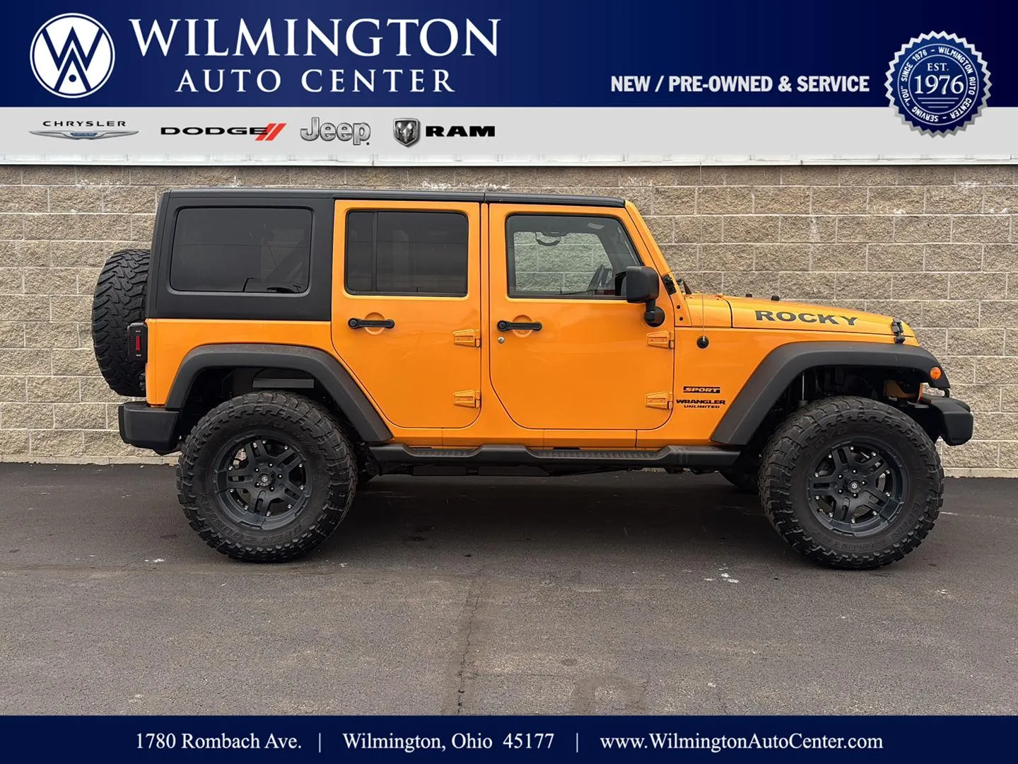 Orange 2012 Jeep Wrangler Unlimited Sport for sale in Wilmington, OH