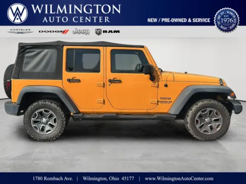Orange 2012 Jeep Wrangler Unlimited Sport for sale in Wilmington, OH