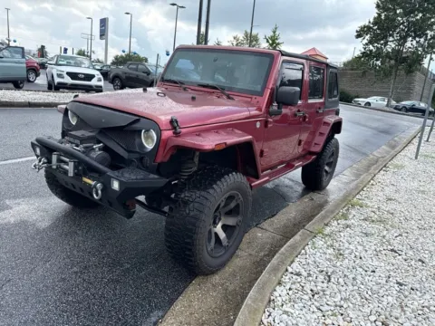 Red 2011 Jeep Wrangler Unlimited Sport for sale in Newnan, GA