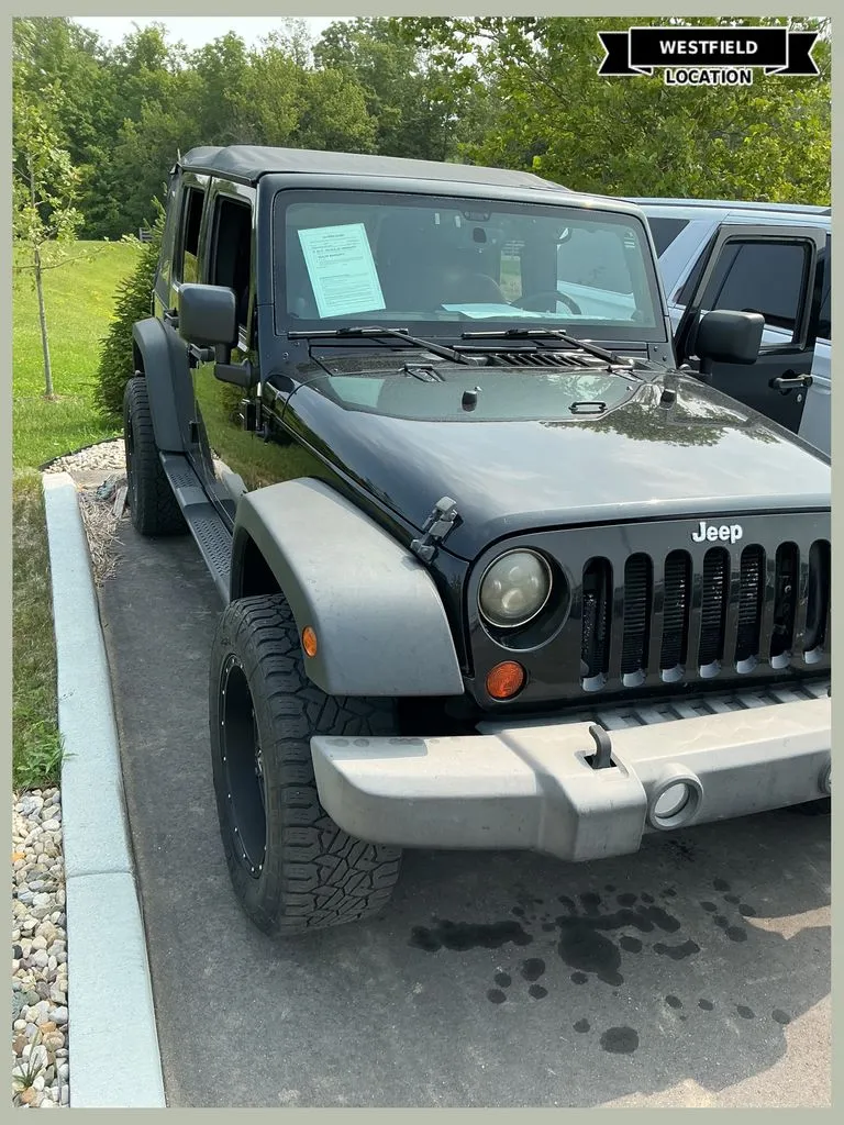 Black 2013 Jeep Wrangler Unlimited Sport for sale in Westfield, IN