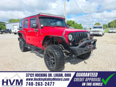 Red 2016 Jeep Wrangler Unlimited Sport for sale in Logan, OH