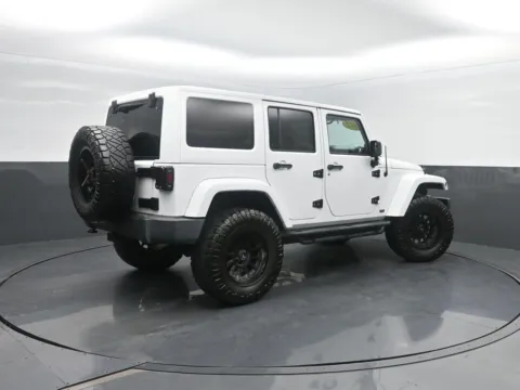 Photos of 2012 Jeep Wrangler Unlimited Sahara for sale in Charles City, IA at Mike Molstead Chevrolet, GMC