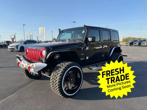 Black 2013 Jeep Wrangler Unlimited Sahara for sale in Charles City, IA