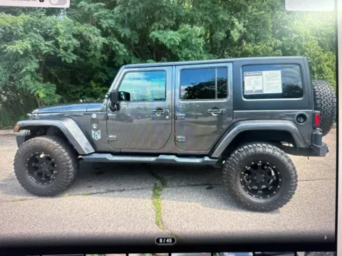 Another view of 2017 Jeep Wrangler Unlimited Sahara for sale in Plaistow, NH at CarFive Plaistow, NH