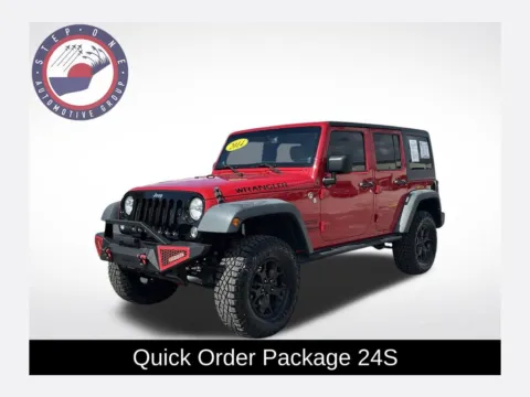 Red 2014 Jeep Wrangler Unlimited Sport for sale in Pensacola, FL