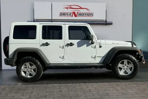 Photos of 2012 Jeep Wrangler Unlimited Rubicon Sport Utility 4D for sale in Thornton, CO at Drive N-Motion Thornton