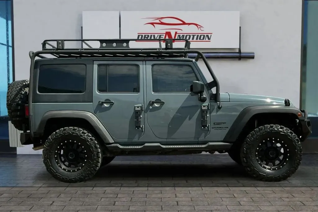 Photos of 2014 Jeep Wrangler Unlimited Sport SUV 4D for sale in Thornton, CO at Drive N-Motion Thornton