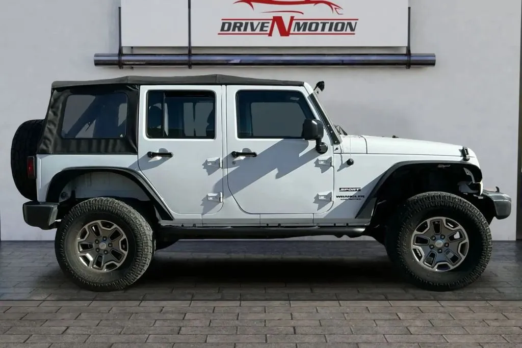 Another view of 2017 Jeep Wrangler Unlimited Sport SUV 4D for sale in Thornton, CO at Drive N-Motion Thornton