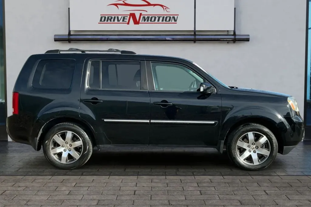Photos of 2012 Honda Pilot Touring Sport Utility 4D for sale in Greeley, CO at Drive N-Motion Greeley