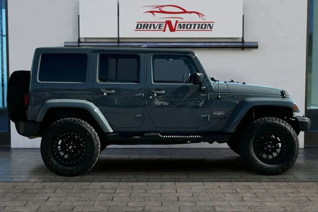 Another view of 2015 Jeep Wrangler Unlimited Sahara Sport Utility 4D for sale in Greeley, CO at Drive N-Motion Greeley